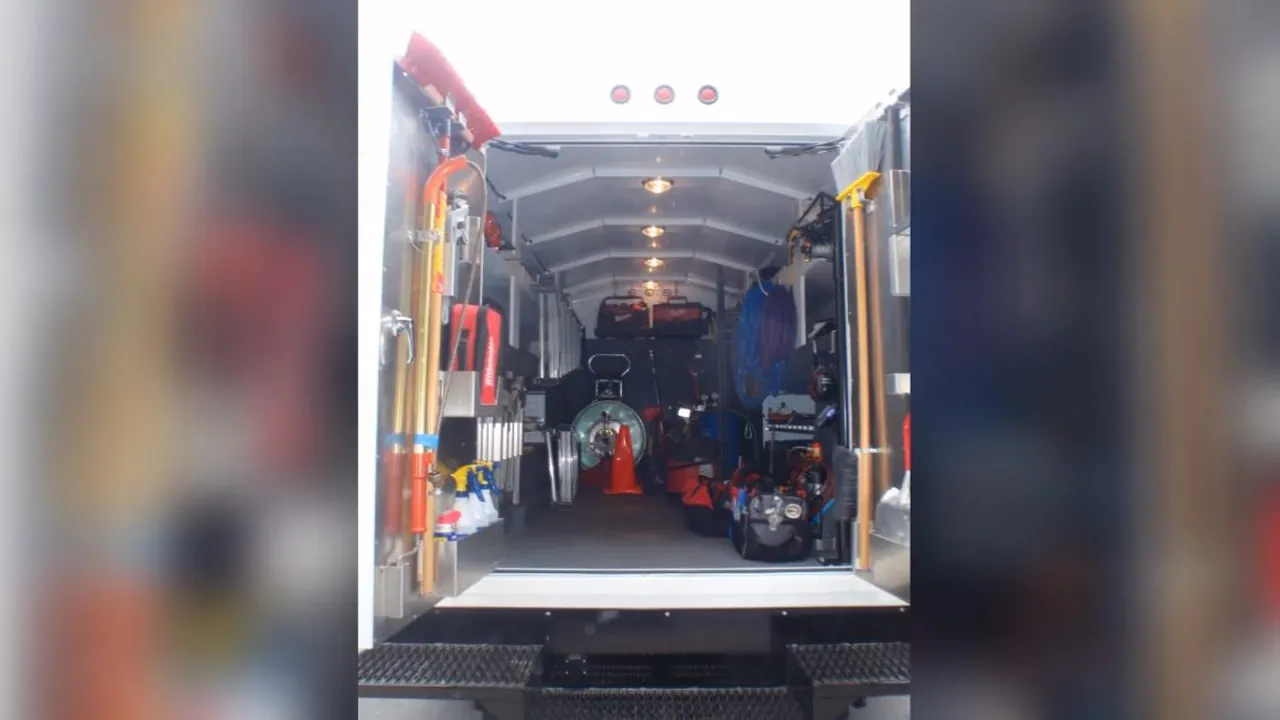 Organized plumbing service van with tools and equipment ready for dispatch