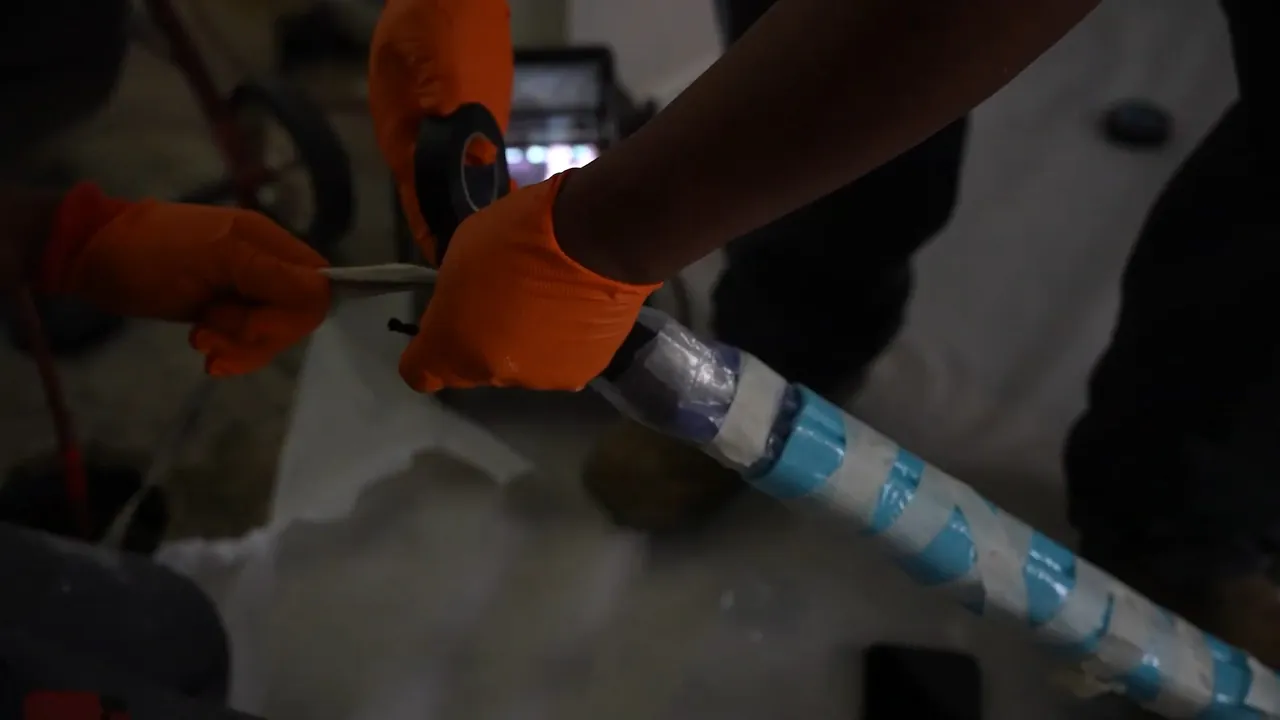 Resin-saturated liner being prepared for a trenchless sewer repair