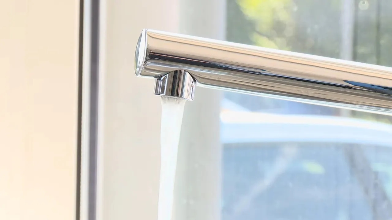 Modern chrome faucet fixture positioned above a sink near Sloan Lake