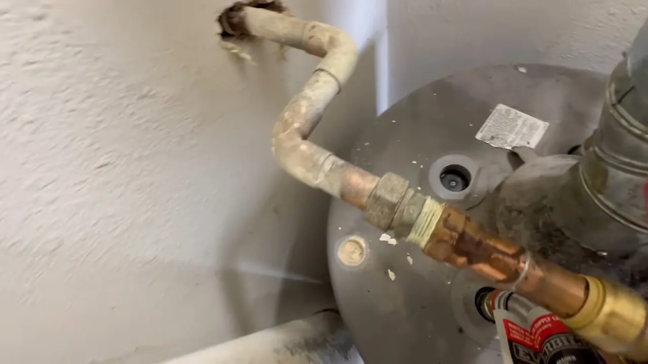 Water heater anode rod connection being inspected on Wheat Ridge Southside